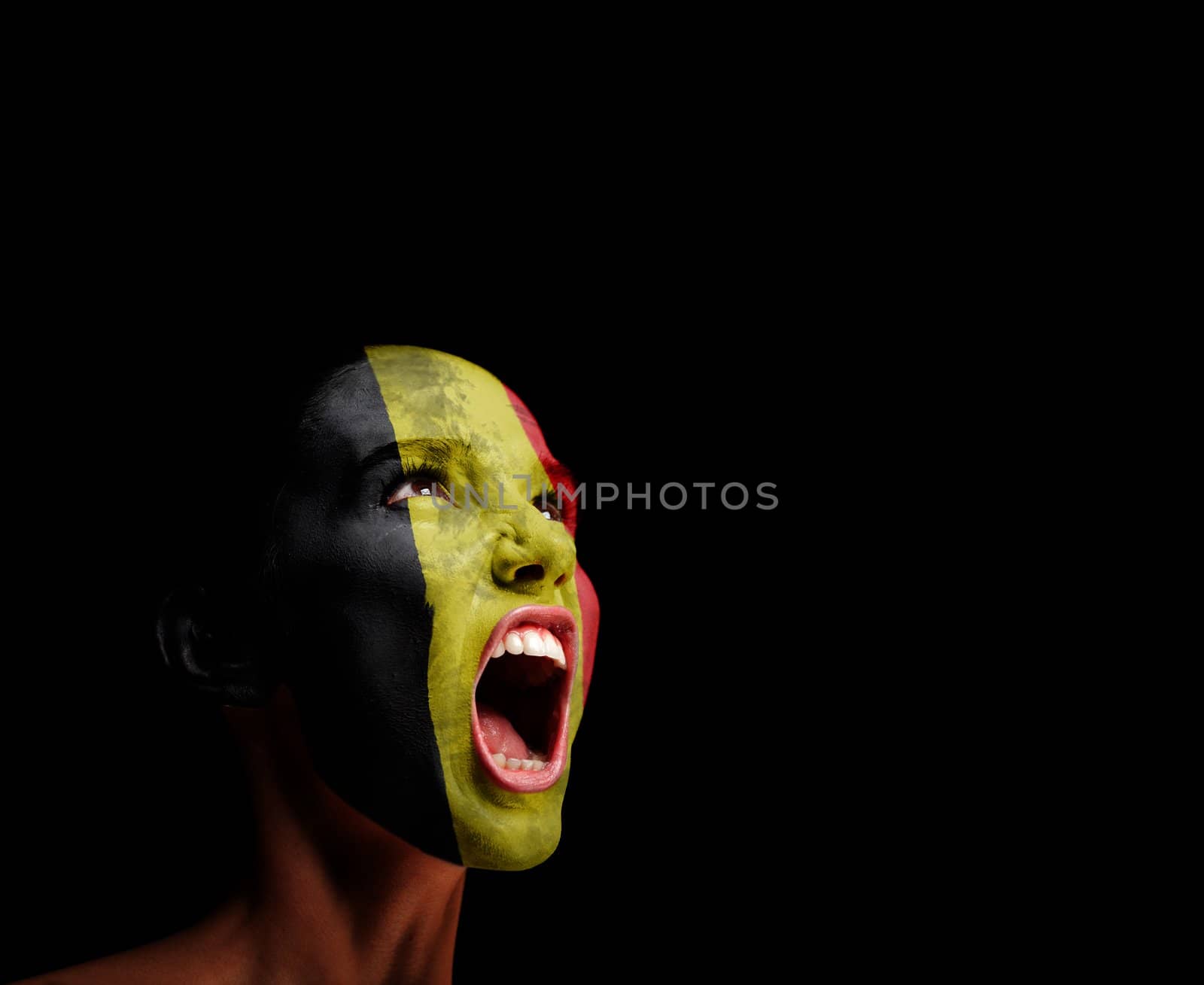 The Belgian flag on the face of a screaming woman. concept