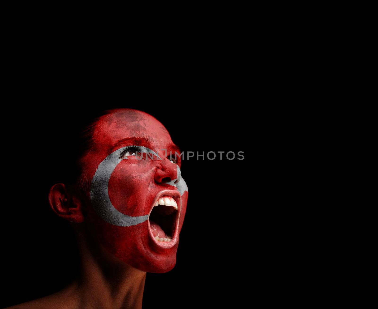 The Turkish flag on the face of a screaming woman. concept