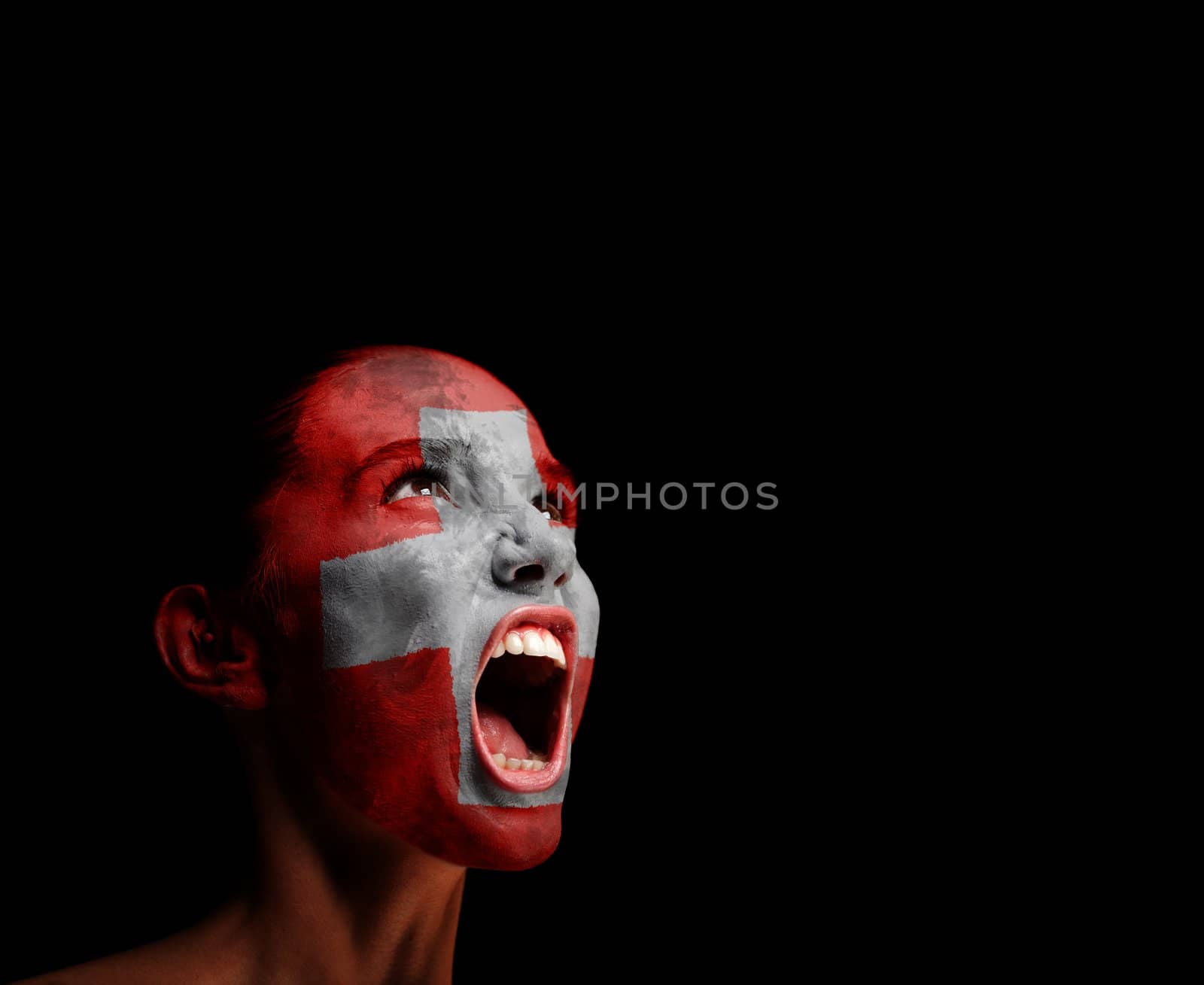 The Swiss flag on the face of a screaming woman. concept