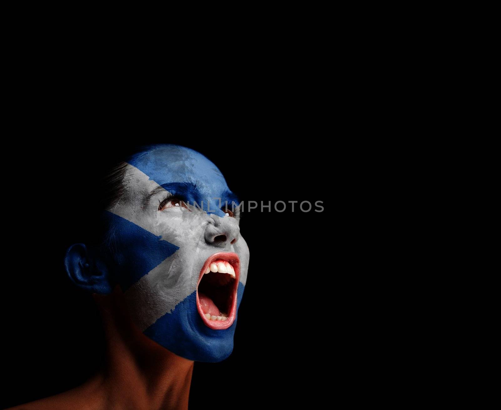 The Scotland flag on the face of a screaming woman. concept