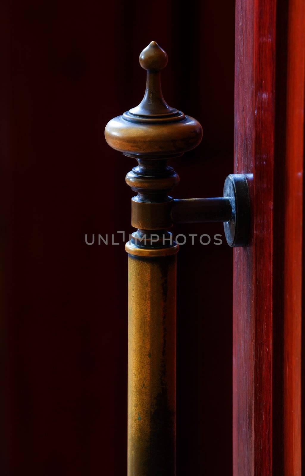 Old brass door handle on wood door