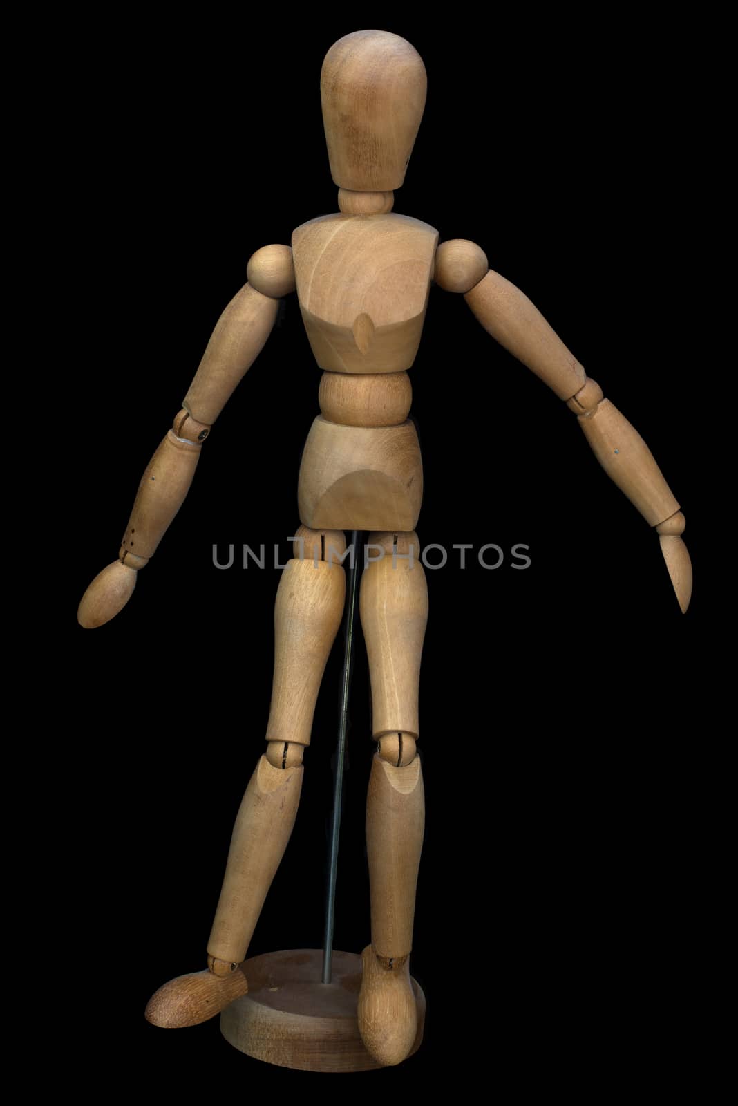 Wooden pose puppet (manikin) on stand with black background
