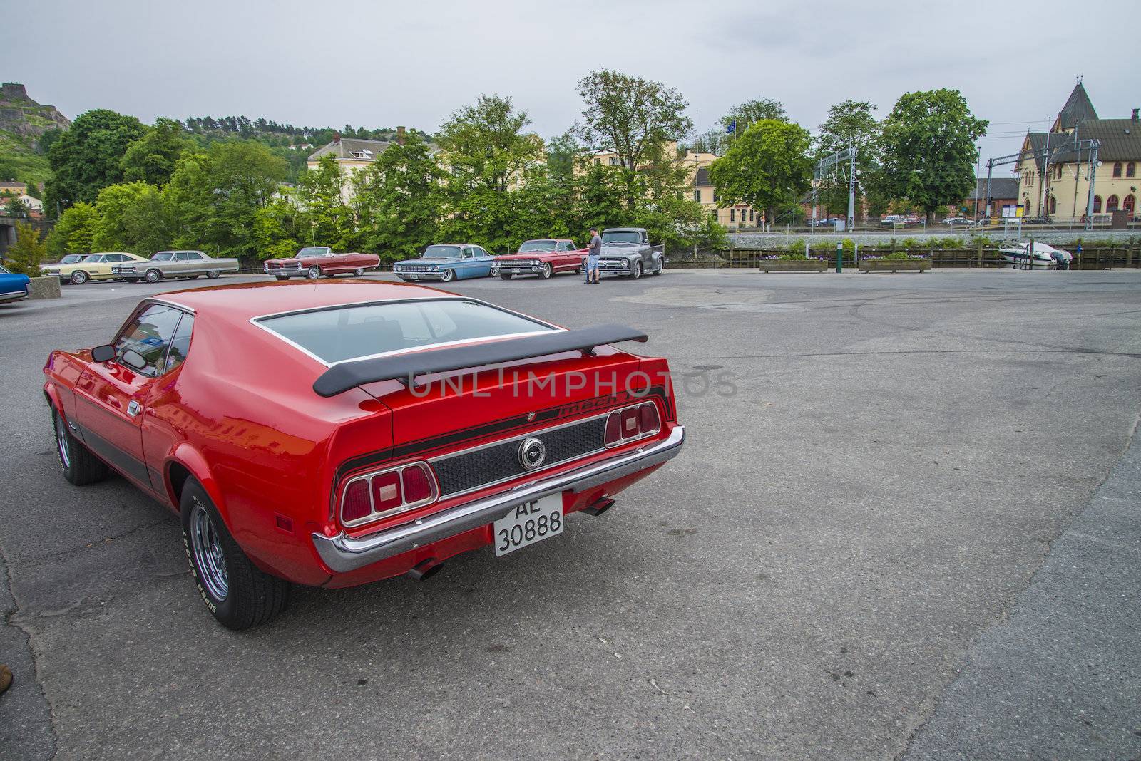 The image is shot at a fish-market in Halden, Norway where there every Wednesday during the summer months are held classic American car show.