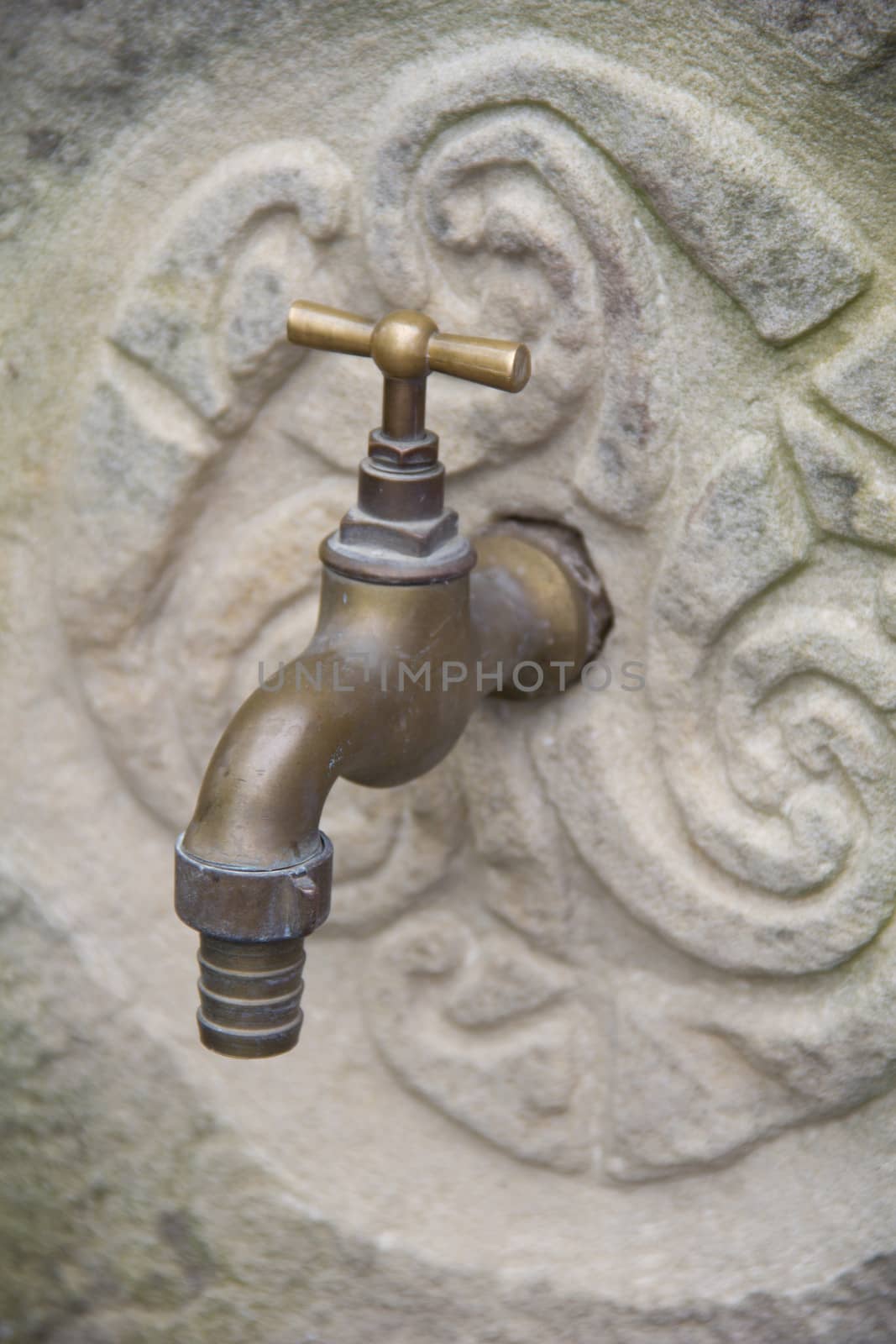 tap on stone wall by marco_govel
