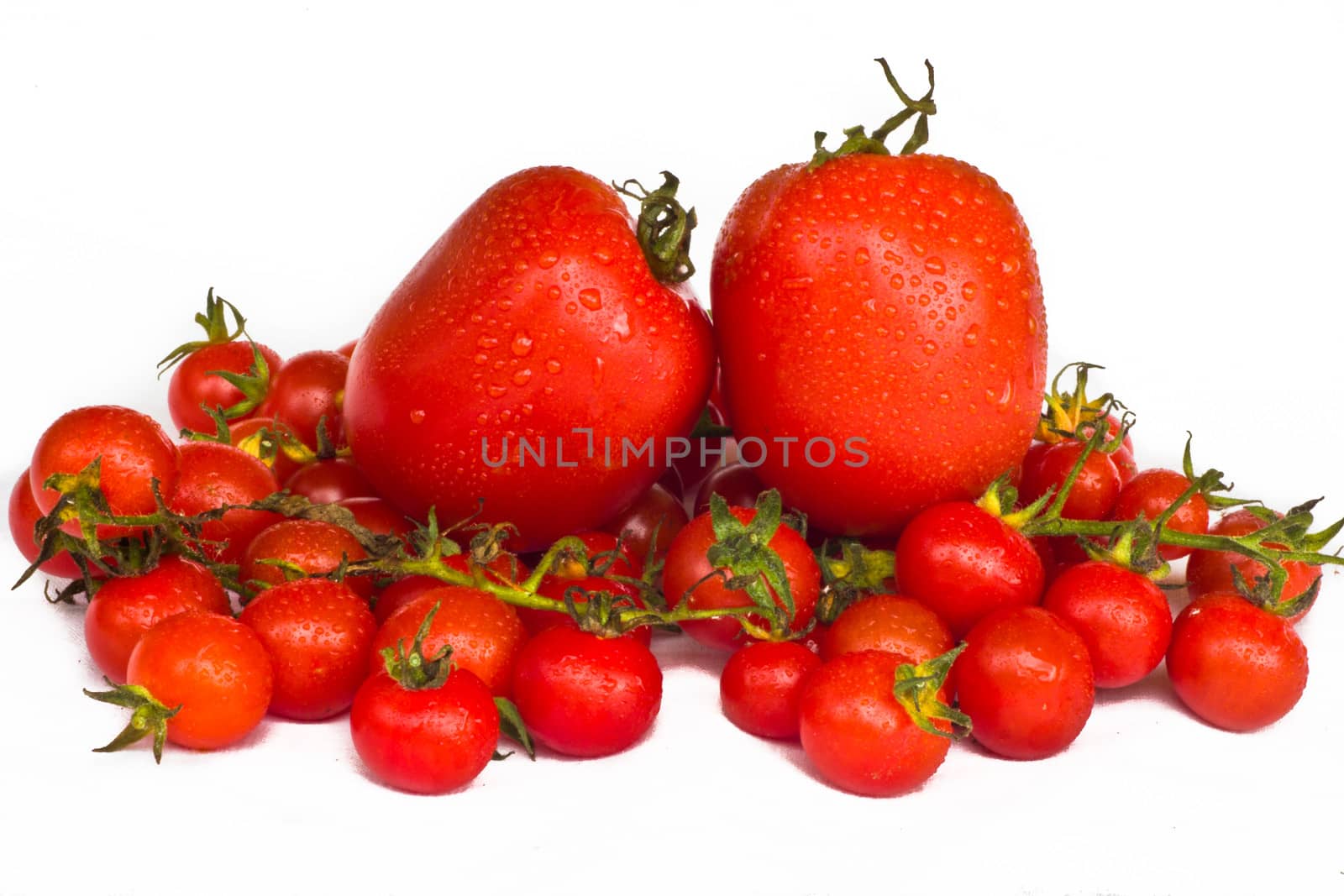 fresh red tomatoes isolated on white