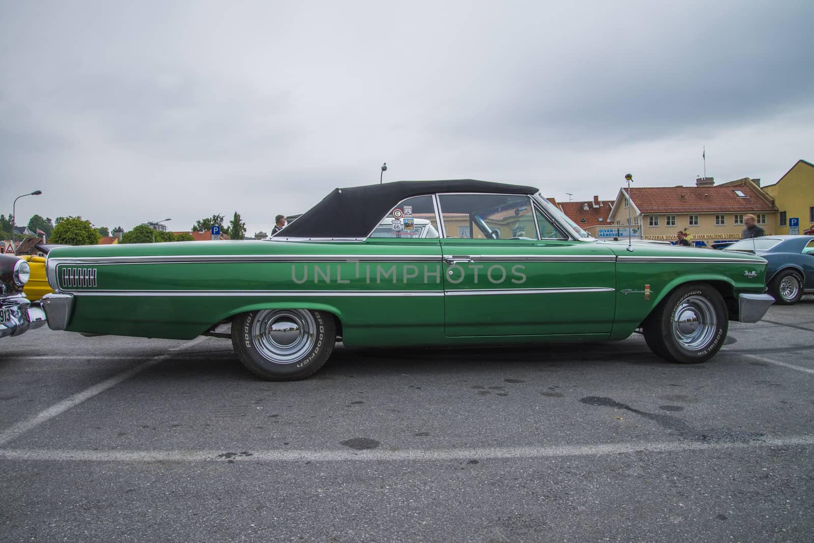 The image is shot at a fish-market in Halden, Norway where there every Wednesday during the summer months are held classic American car show.