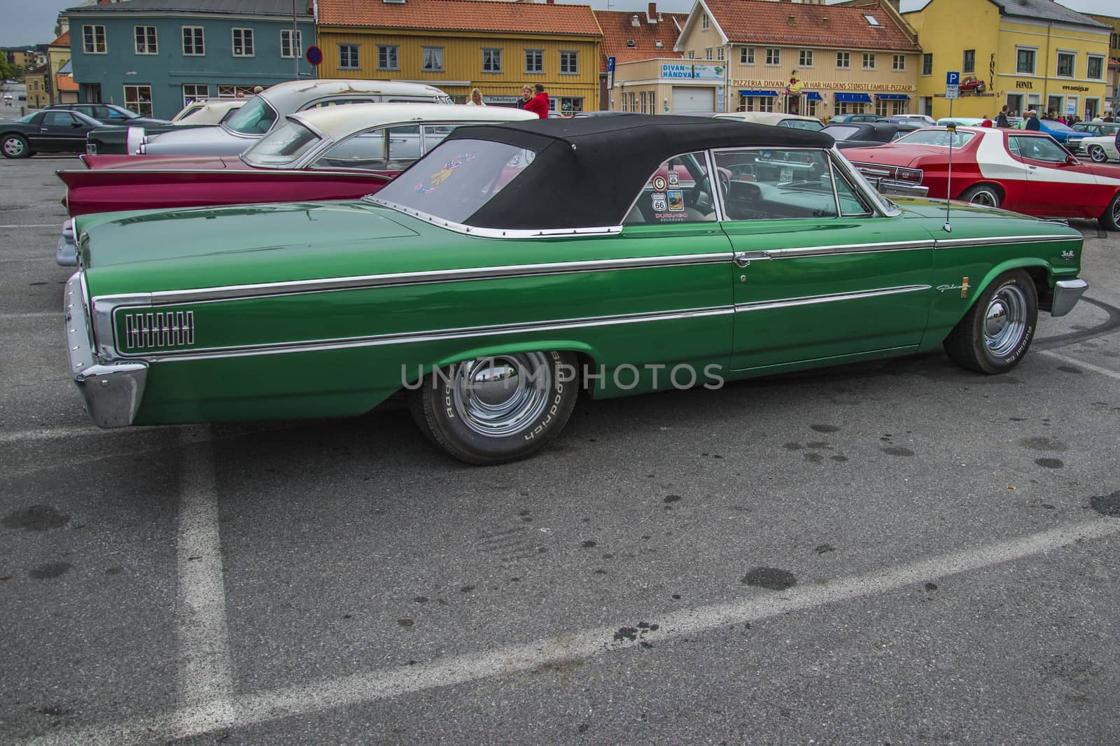The image is shot at a fish-market in Halden, Norway where there every Wednesday during the summer months are held classic American car show.