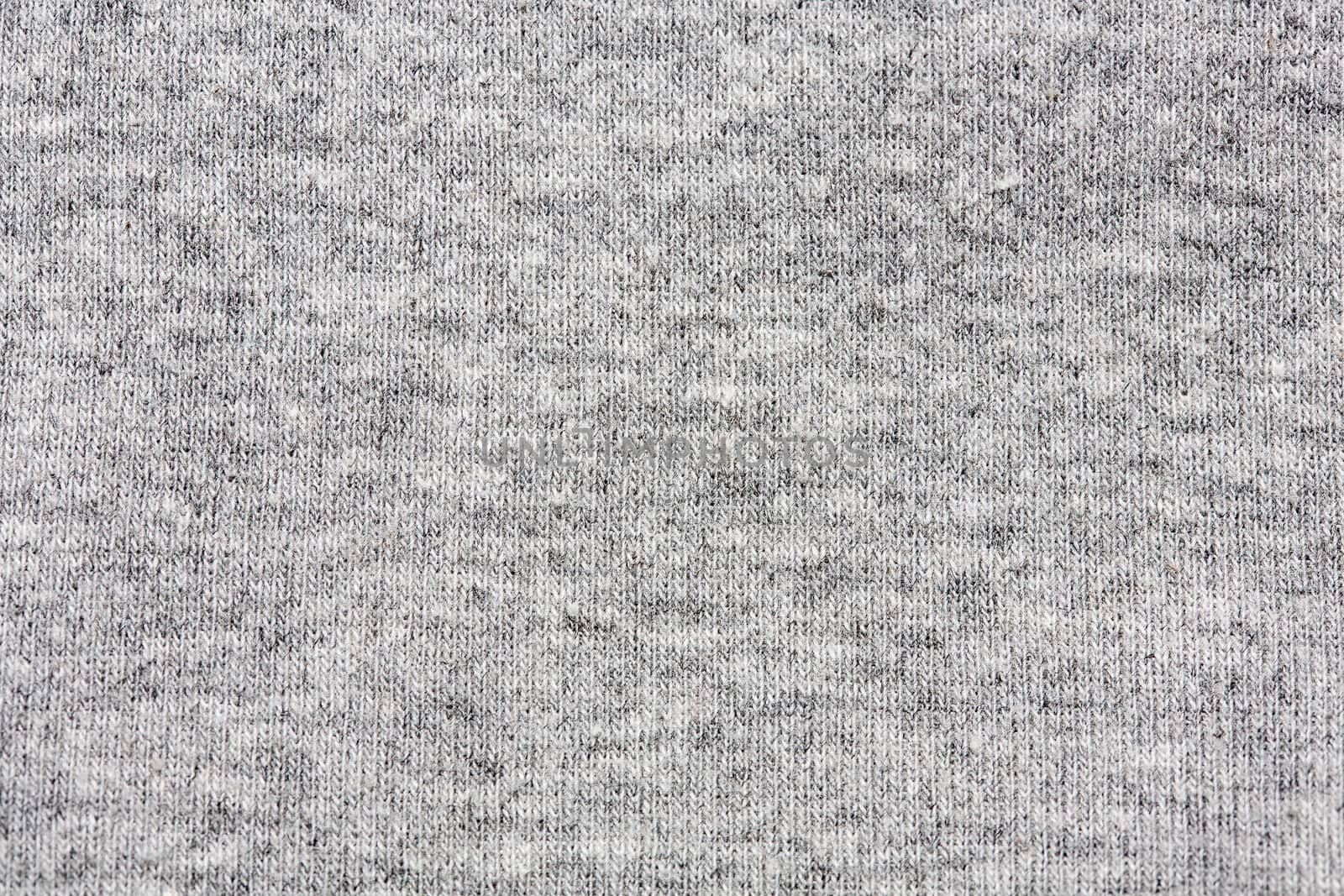 High resolution close up of gray cotton fabric with seams crossing.
