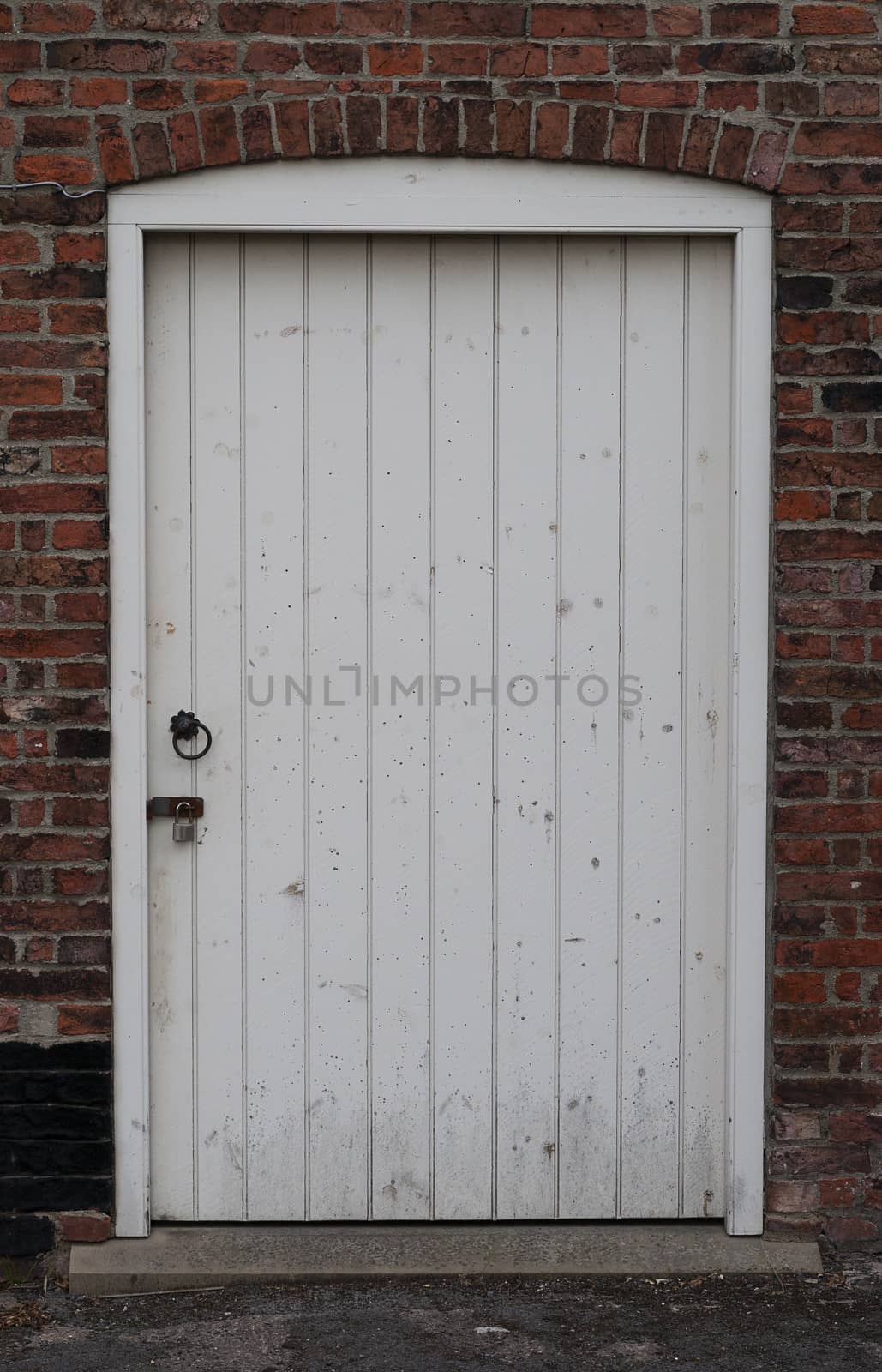 Old wooden rustic door with padlock
