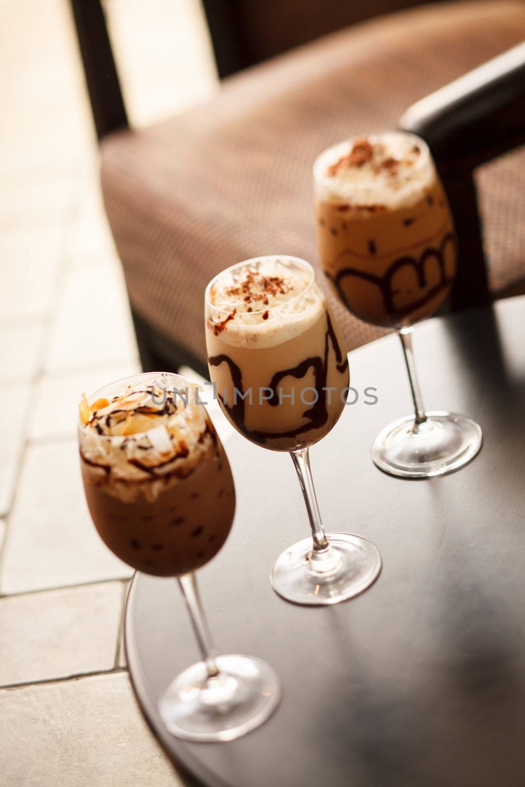 cold fresh ice coffee with chocolate close up  by shebeko