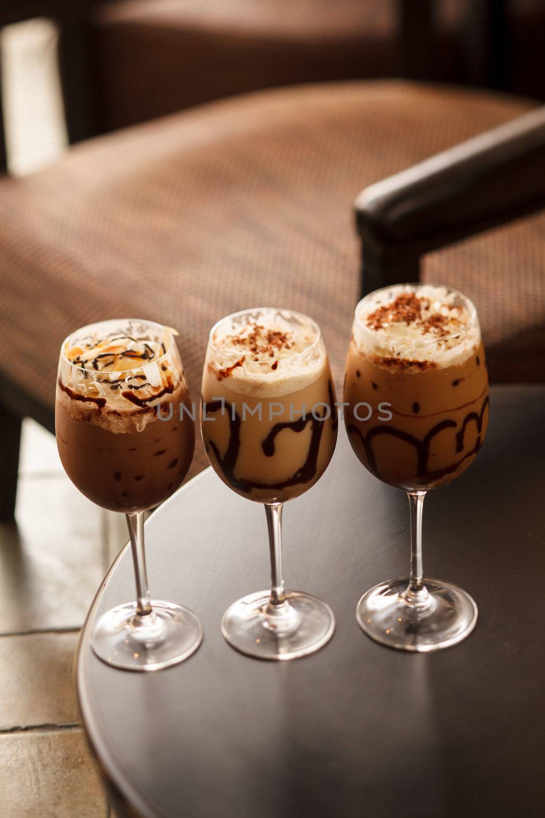 cold fresh ice coffee with chocolate close up  by shebeko
