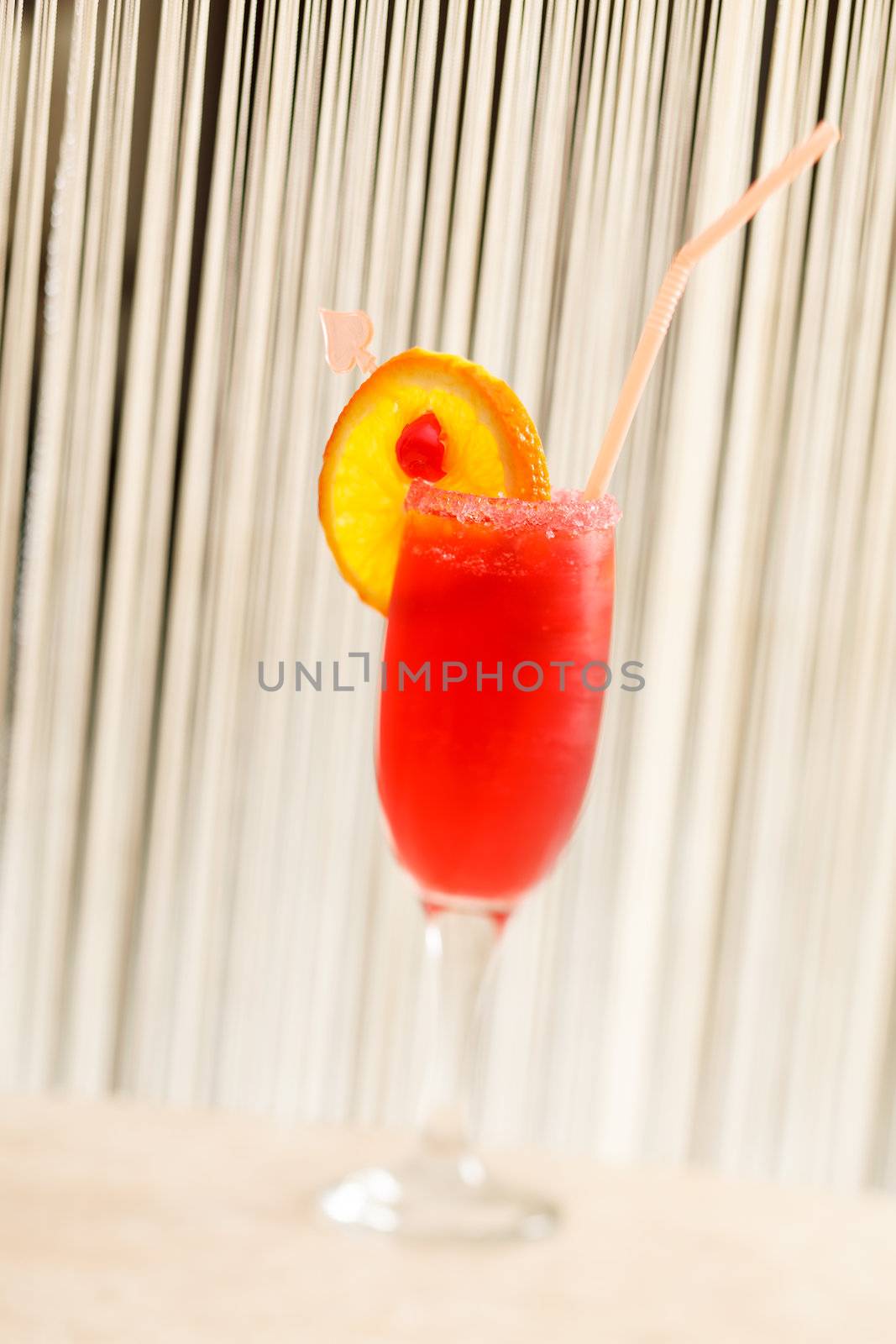 red cocktail with orange by shebeko