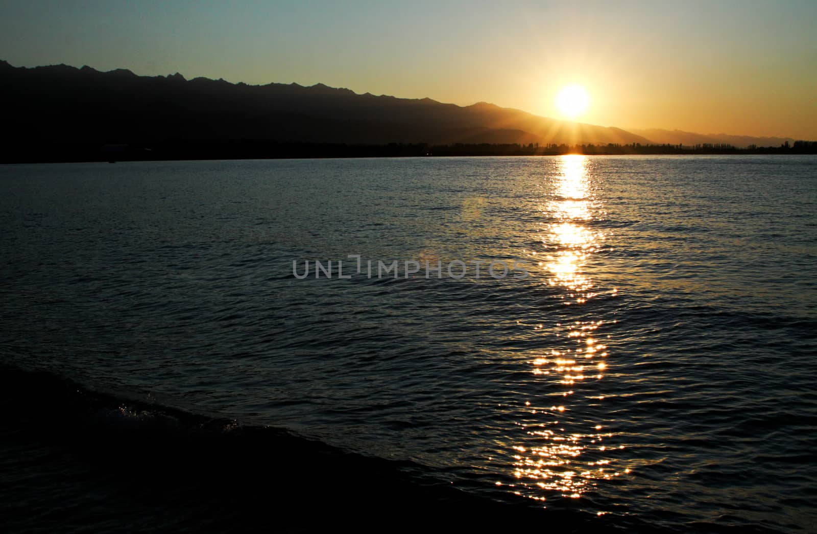 sunset on the lake early summer morning