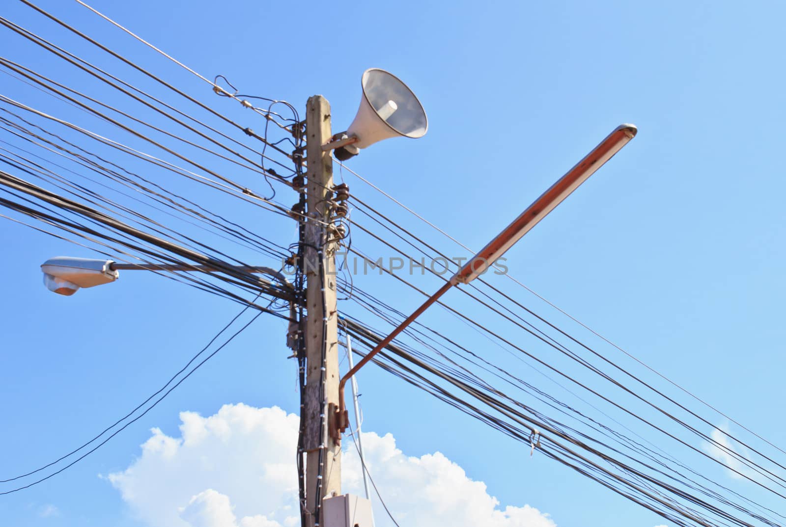 Electricity post in blue sky and clouds