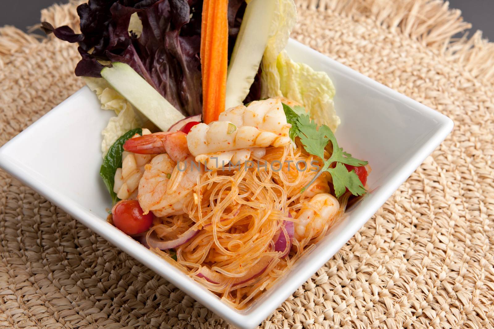 Thailand style seafood salad with clear vermicelli style rice noodles and veggies.