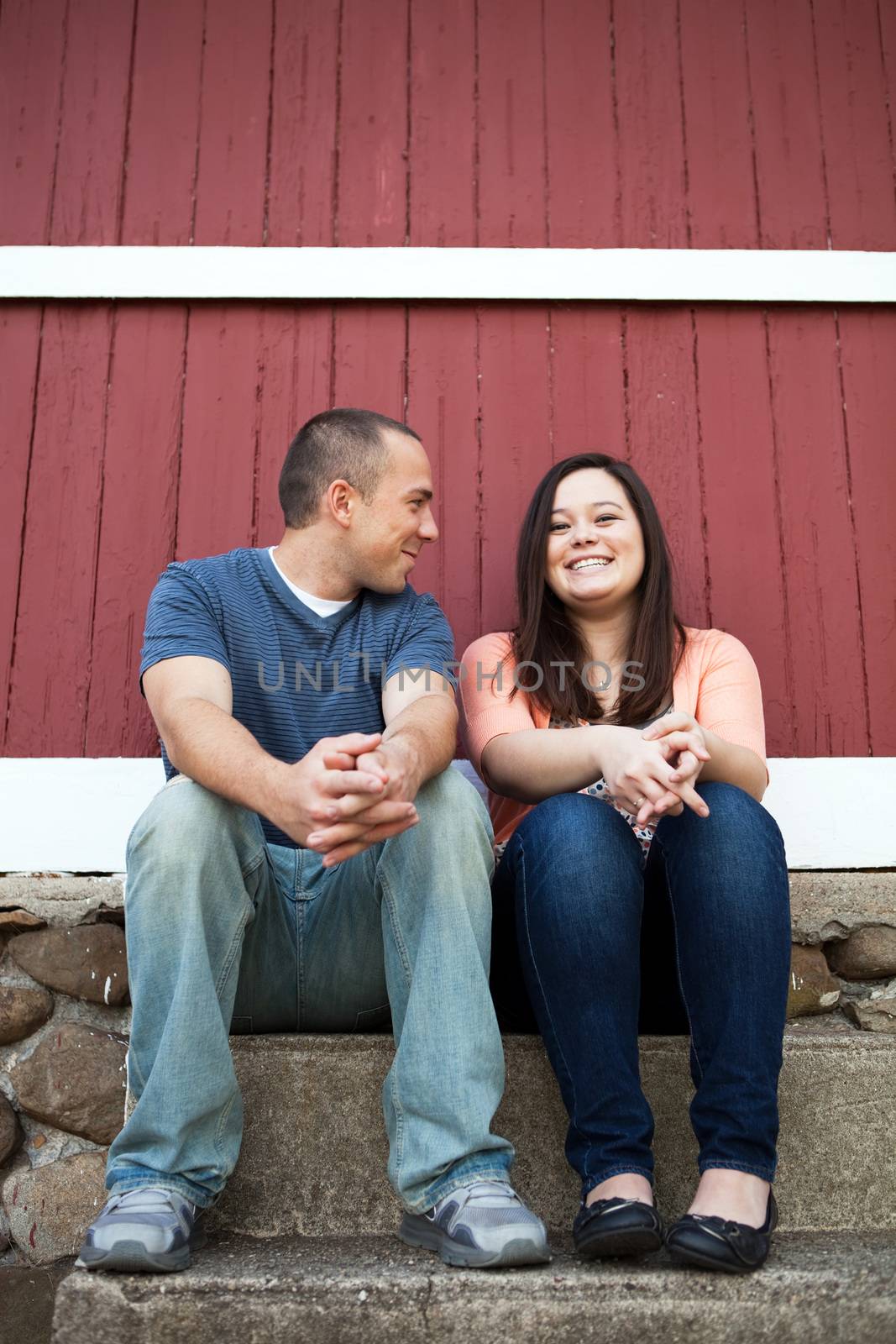 Young happy couple enjoying each others company outdoors.