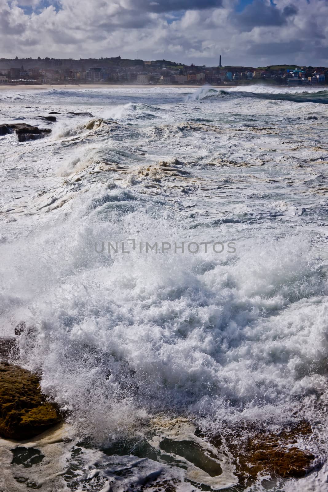 Landscape shot of sea water is crashing over the rock