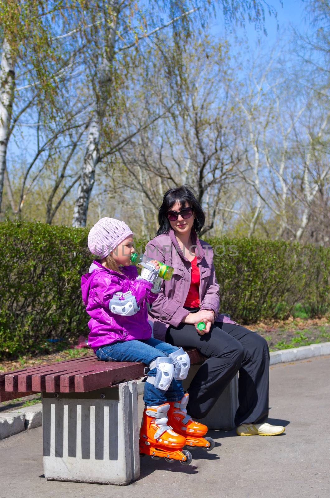Little girl with her mother at park