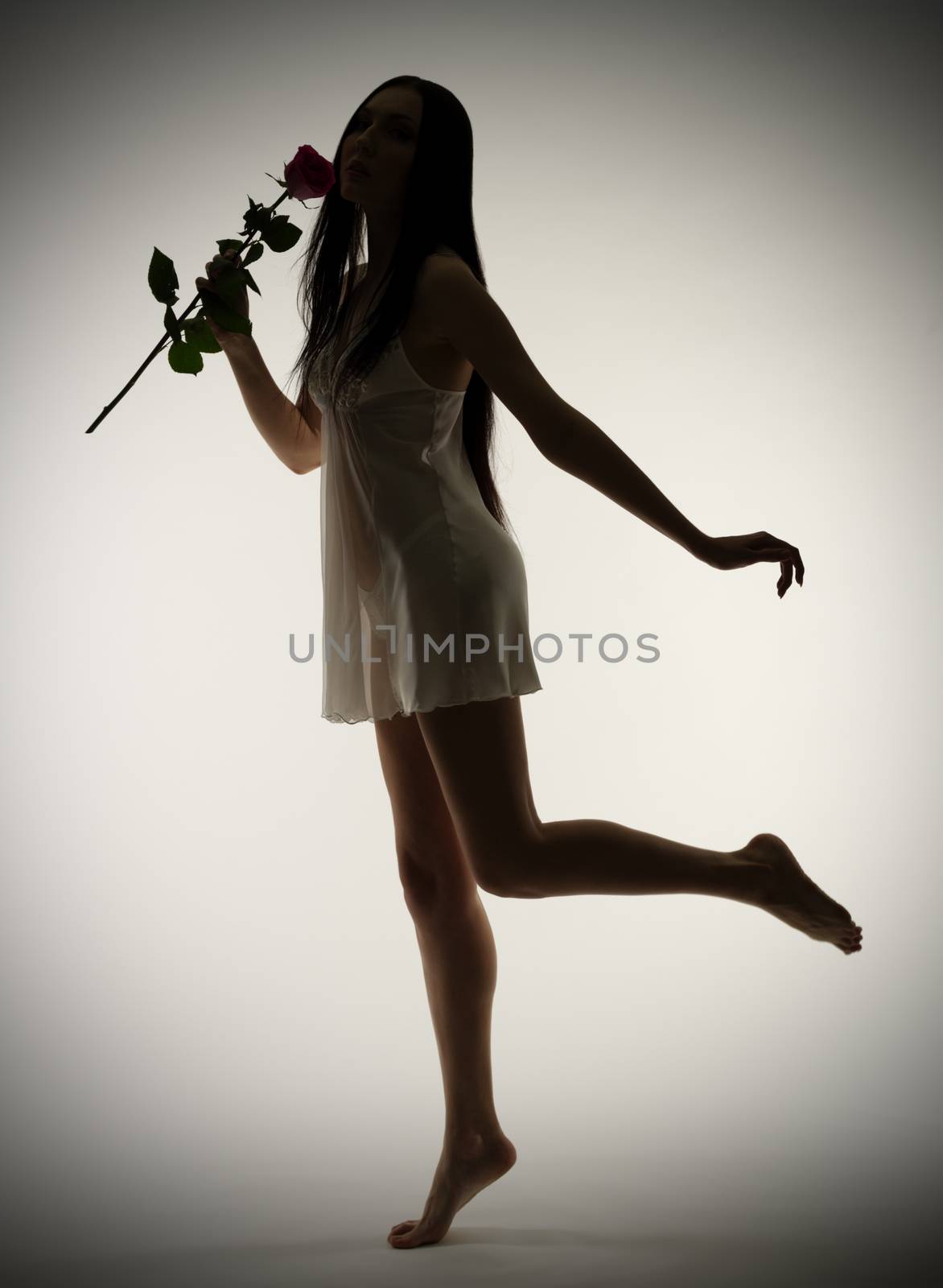 Portrait of young girl with rose flower (colour)