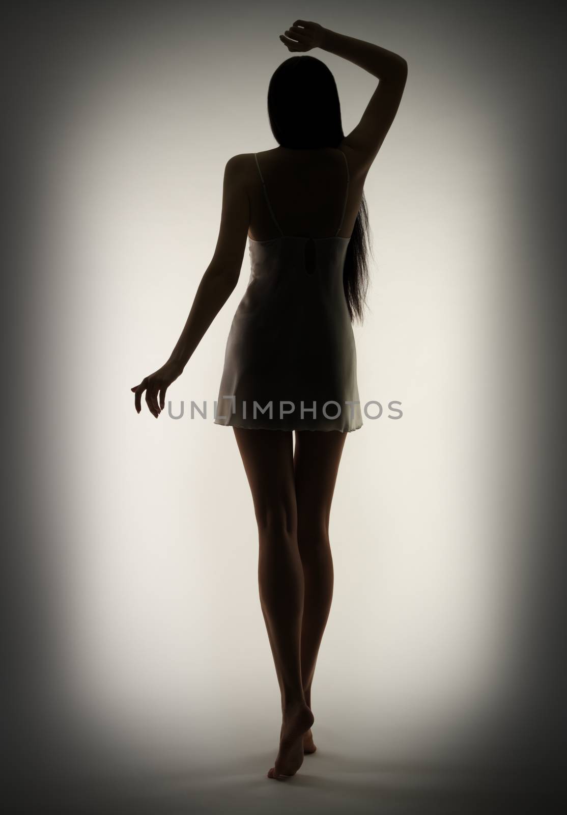 Silhouette of young girl on gray by rbv