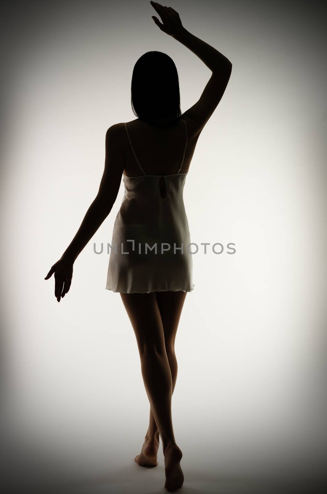 Silhouette of young girl on gray background