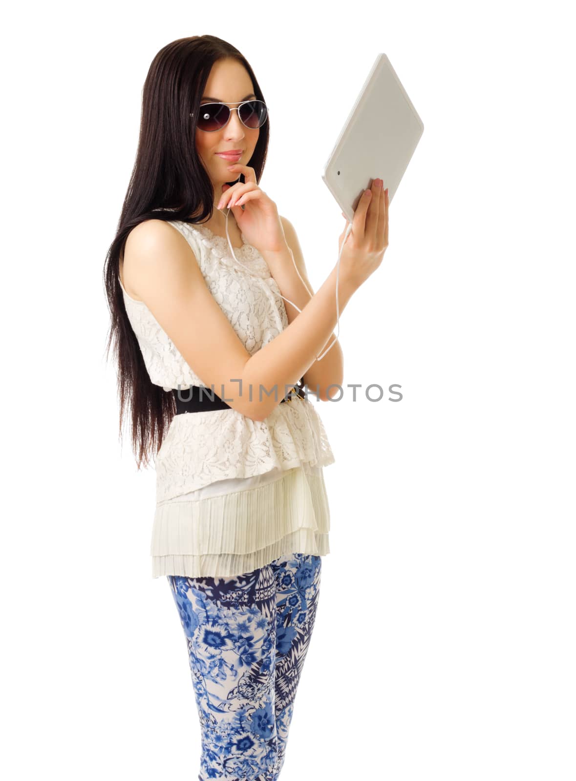 Young girl talks by tablet PC isolated