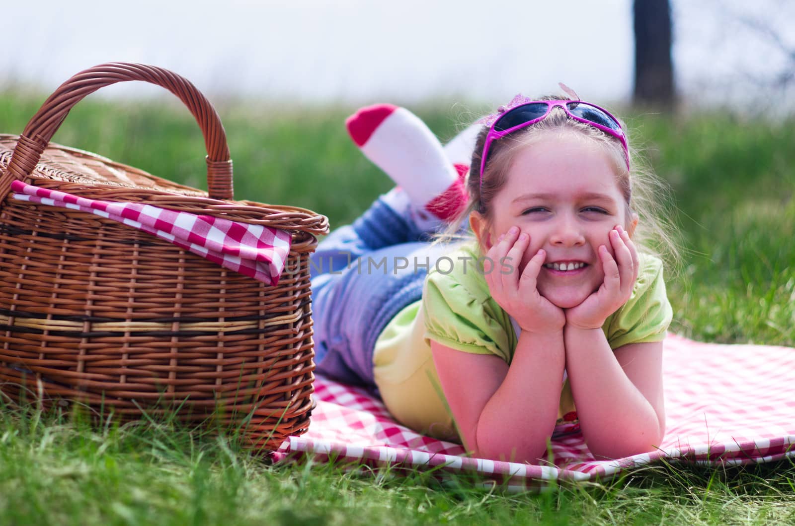 Little smiling girl with picnic basket by rbv