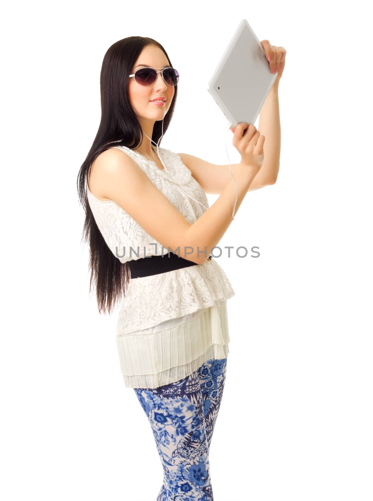 Girl in sunglasses and blue pants with tablet PC by rbv