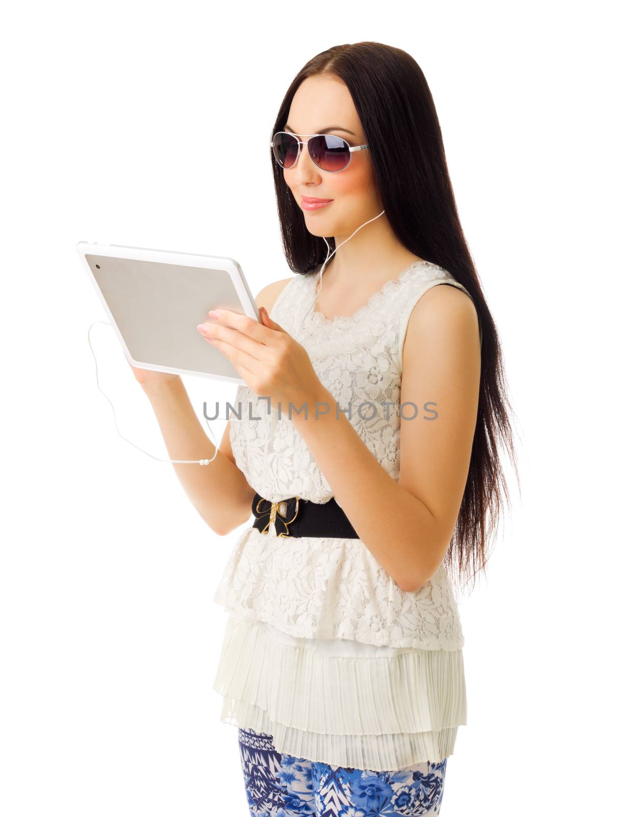 Young girl talks by tablet PC isolated