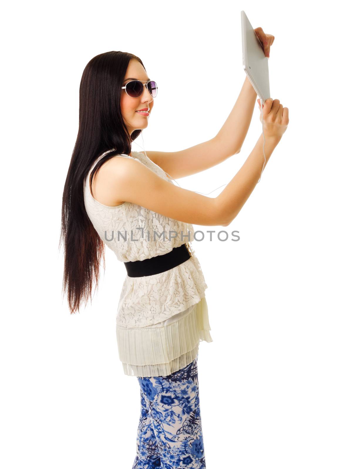 Young girl talking by tablet PC isolated