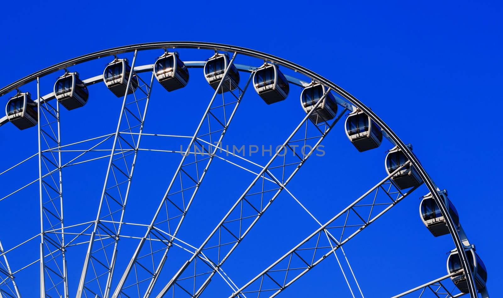 White ferris wheel in blue sky