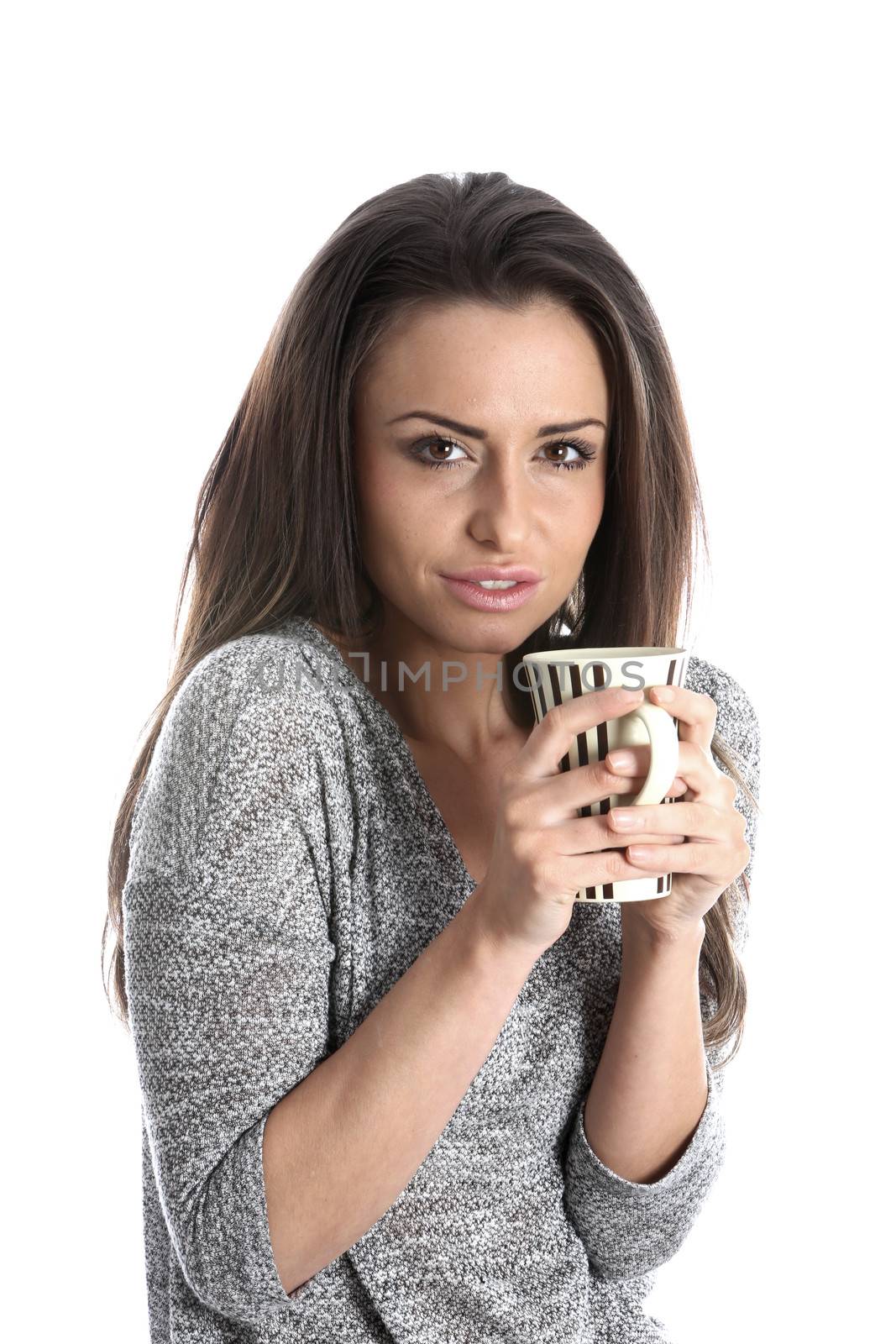 Model Released. Woman Drinking a Mug of Tea