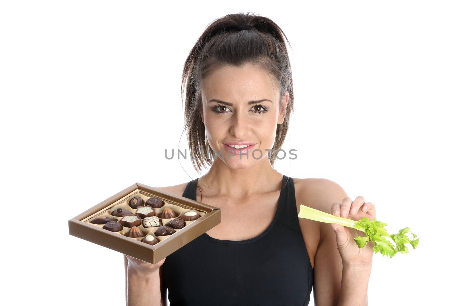 Model Released. Woman Holding Celery and Chocolates
