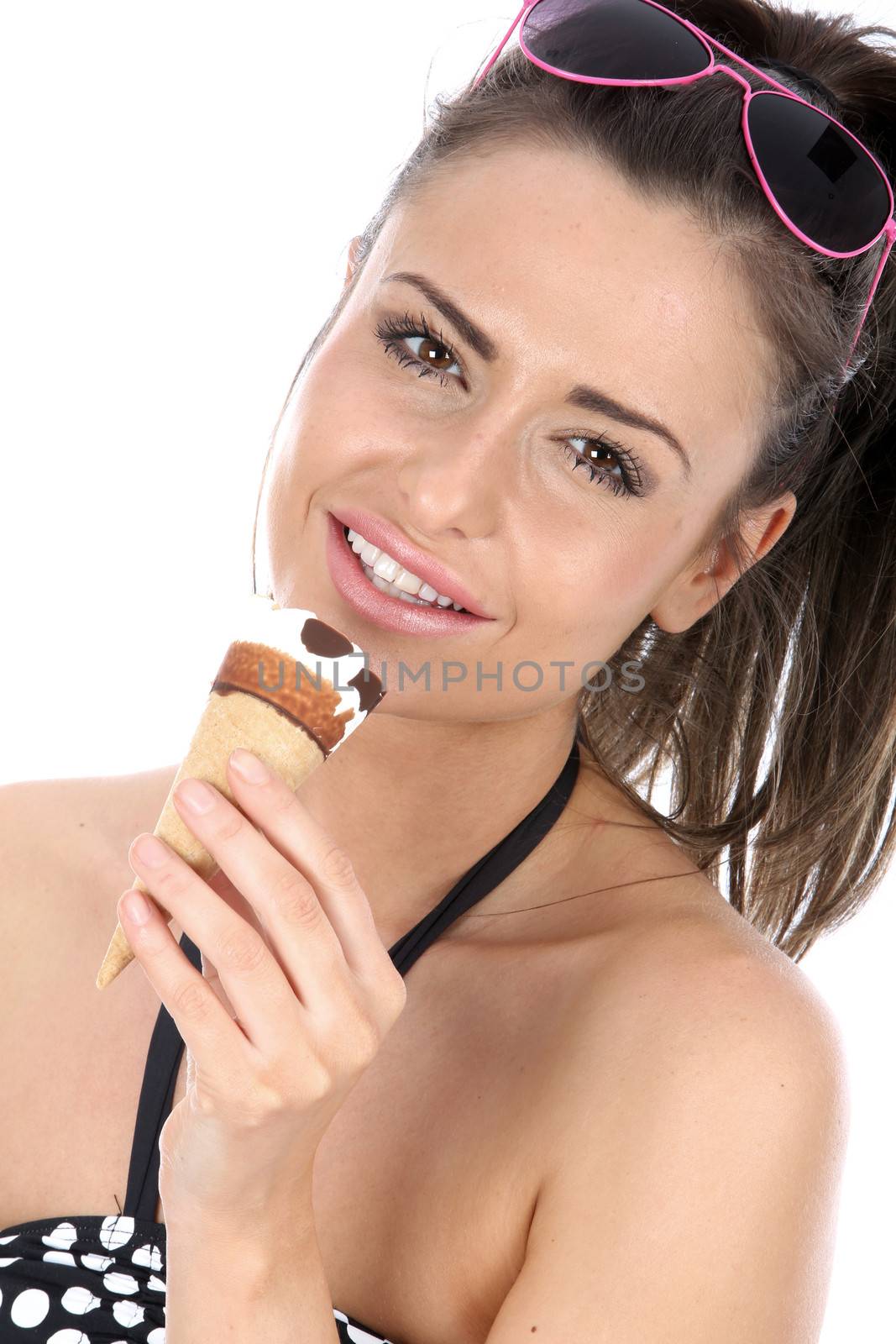 Model Released. Woman Eating a Cornetto Ice Cream isolated white background