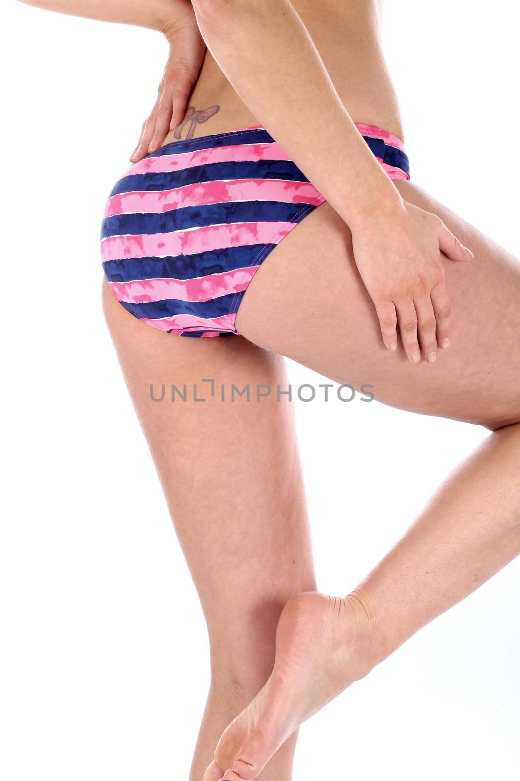 Model Released. Sexy Young Woman Wearing Bikini Bottoms by Whiteboxmedia