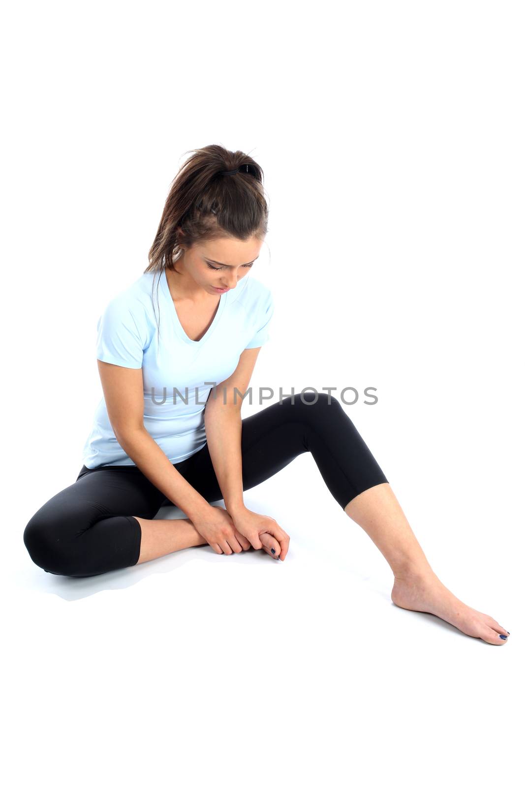 Model Released. Woman With Ankle Sports Injury