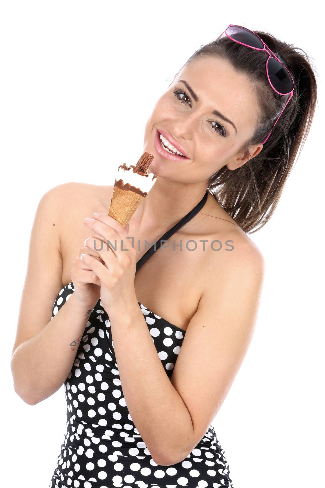 Model Released. Woman Eating Ice Cream Cornet by Whiteboxmedia