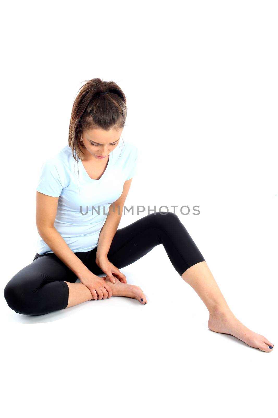 Model Released. Woman With Ankle Sports Injury