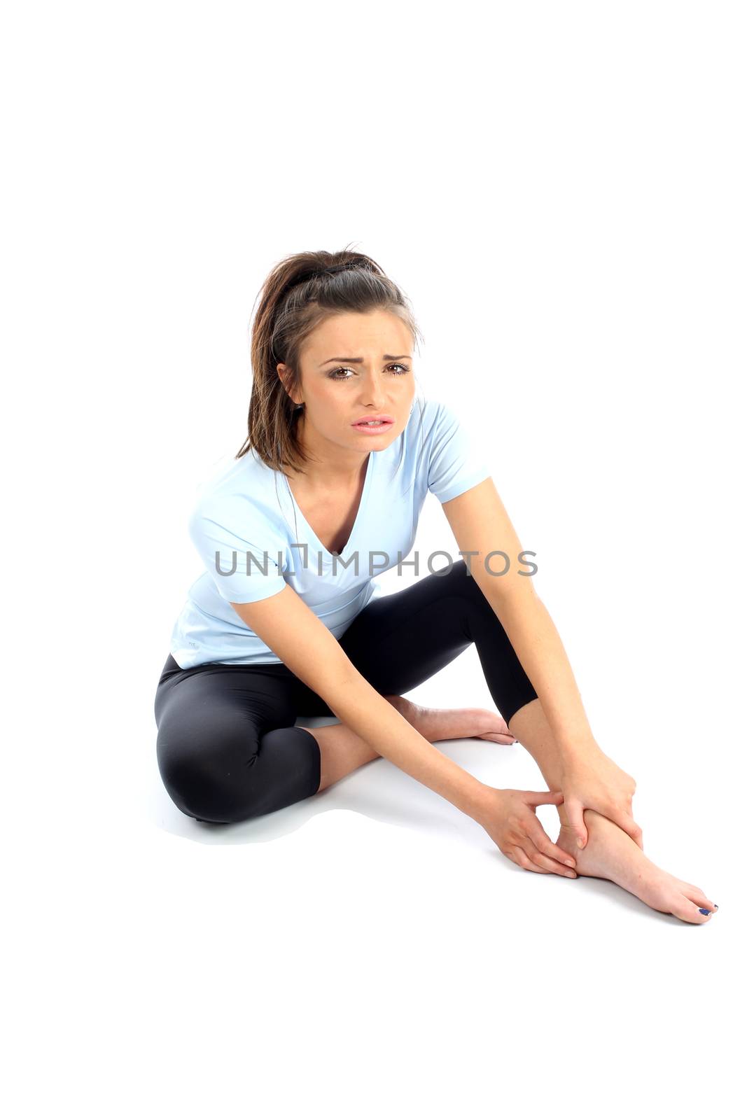 Model Released. Woman With Ankle Sports Injury