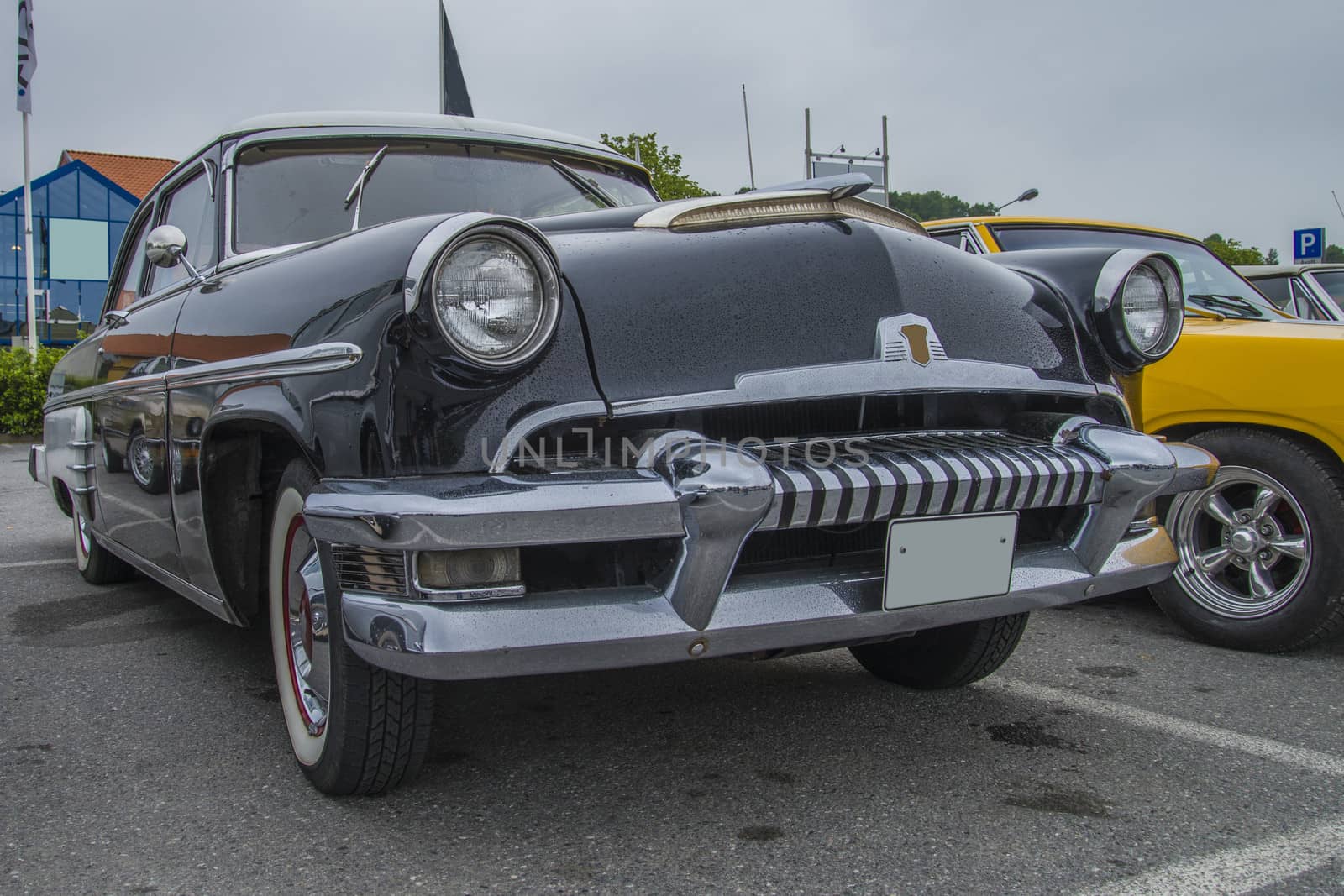 The image is shot at a fish-market in Halden, Norway where there every Wednesday during the summer months are held classic American car show.