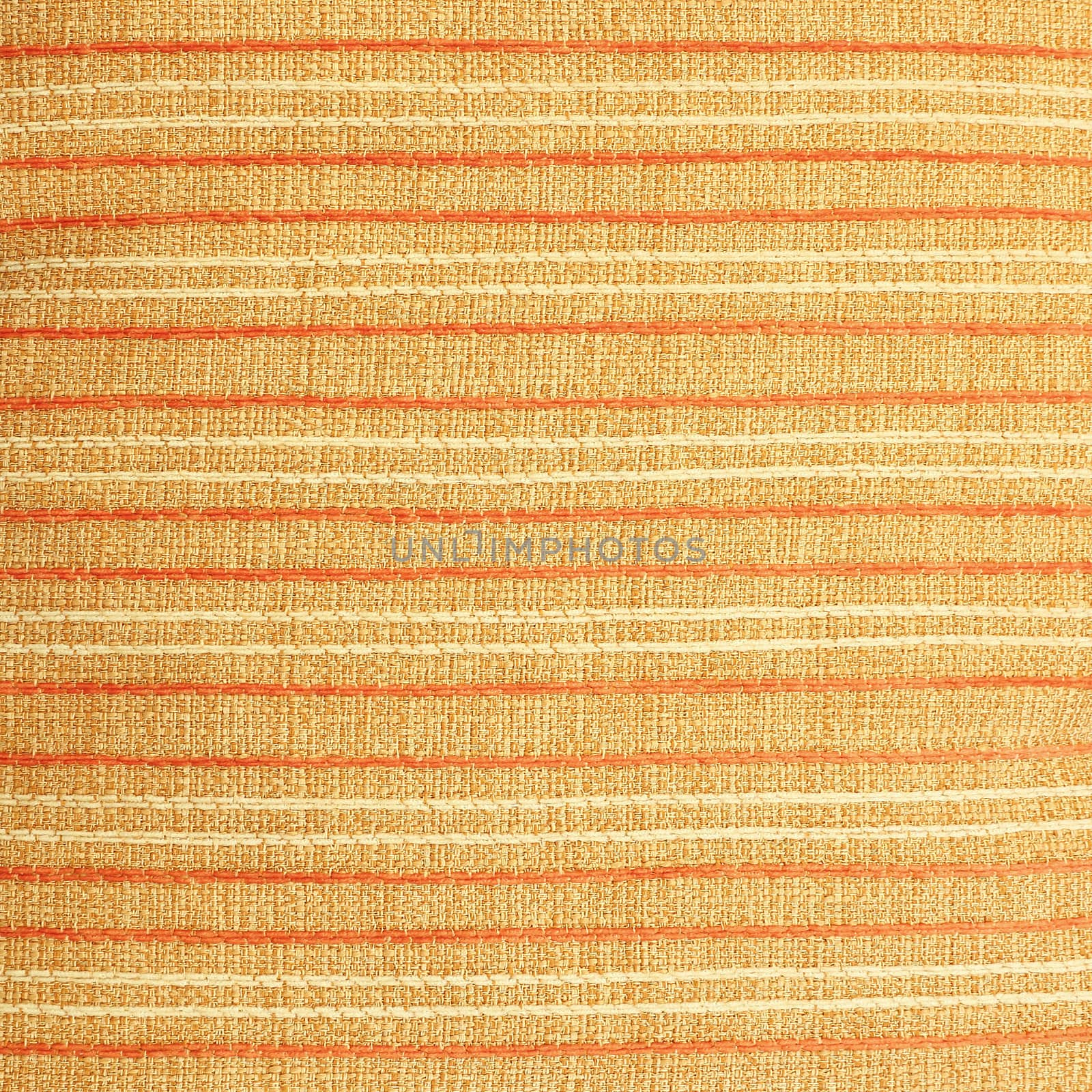 Fabric texture with orange and white lines on brown background