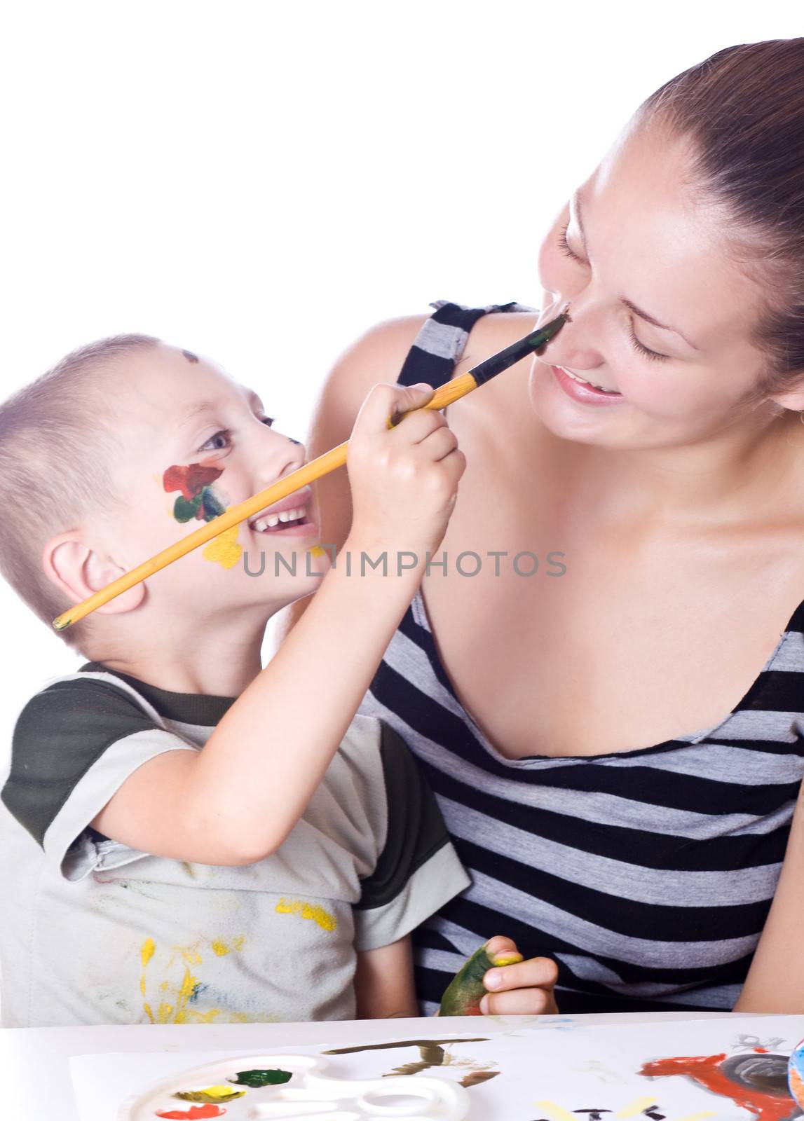 Brother draws on the face of her sister