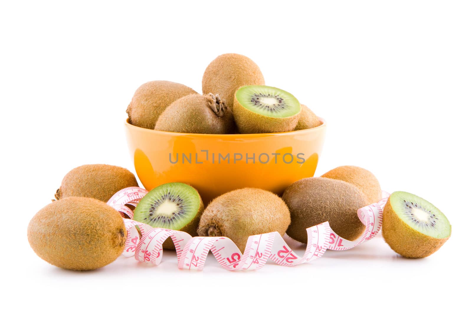 Kiwi fruits and tailor tape isolated on white