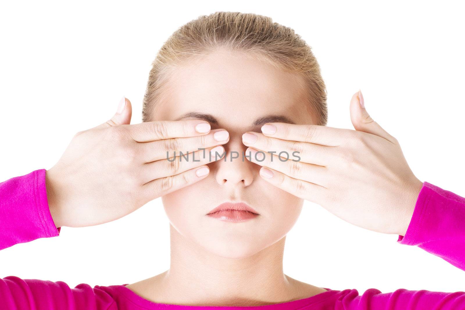 Young teen woman covering her face with hands, isolated on white