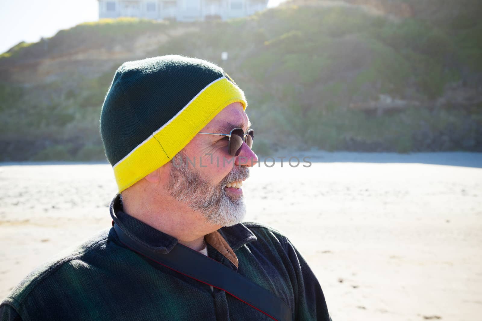 Portrait of Man at Beach by joshuaraineyphotography