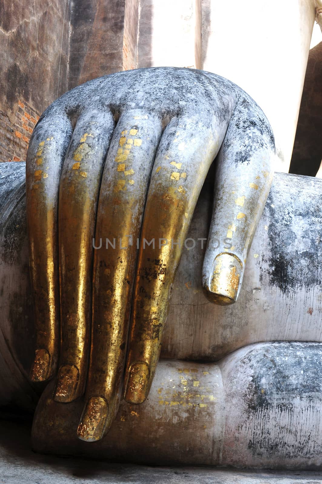 Statue of a giant Buddha's hand in the Historical Park of Sukhothai, Thailand