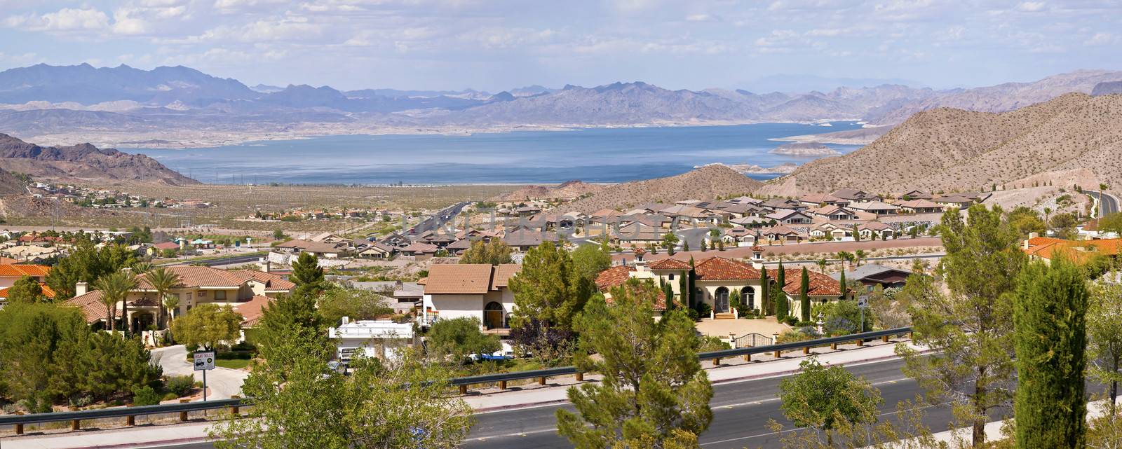 Lake Meade Bolder City Nevada suburb and mountains panorama. by Rigucci