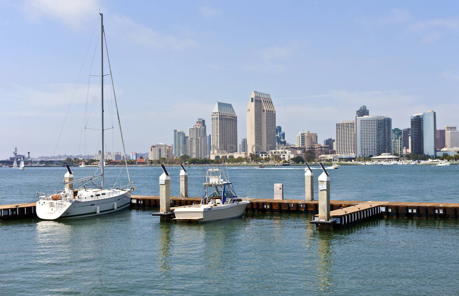 San Diego skyline and sailboats in a marina California. by Rigucci