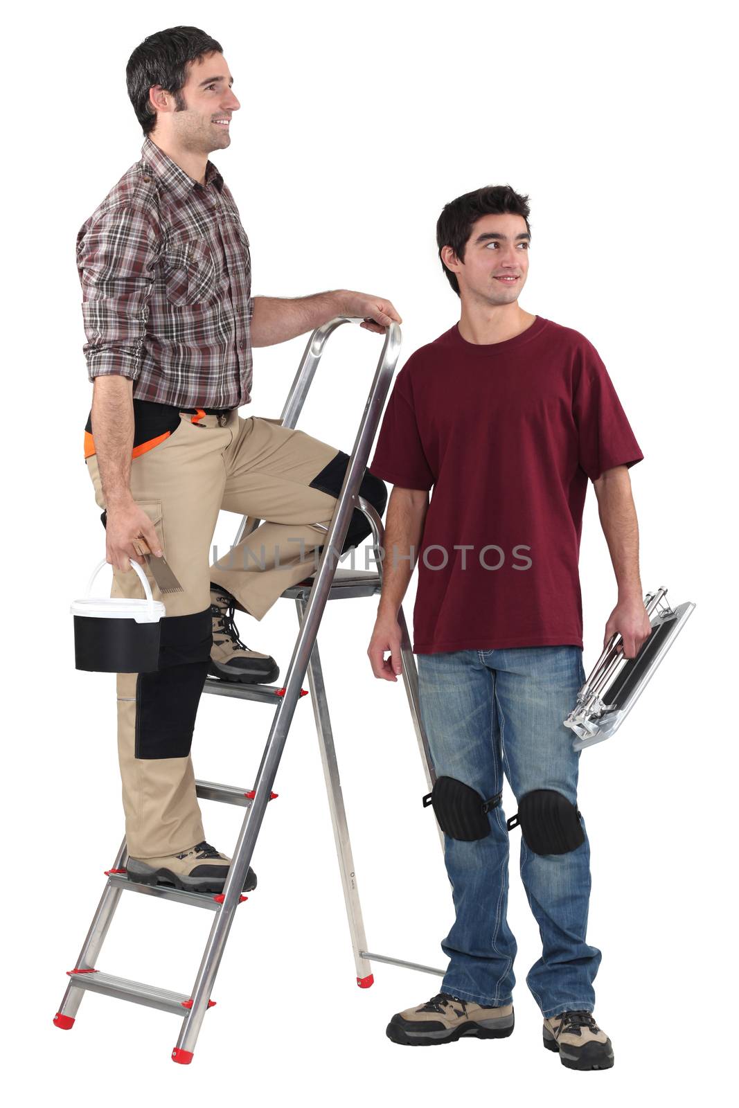 Two decorator stood with step-ladder by phovoir