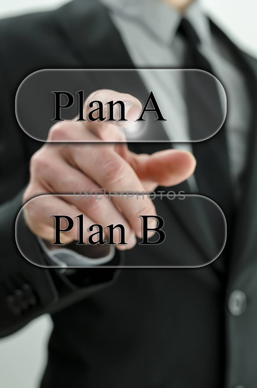 Business man choosing plan A on virtual screen.